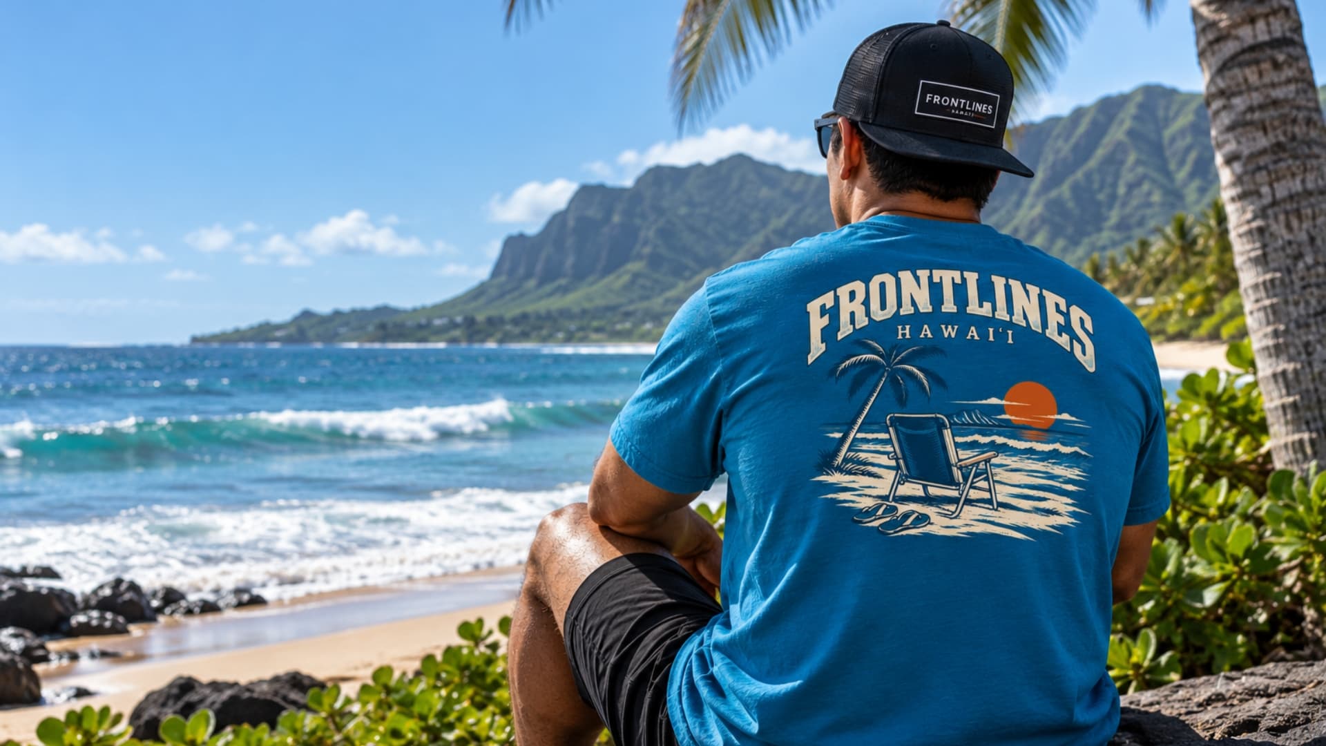 Frontlines tee and cap worn beside the ocean in Hawaiʻi
