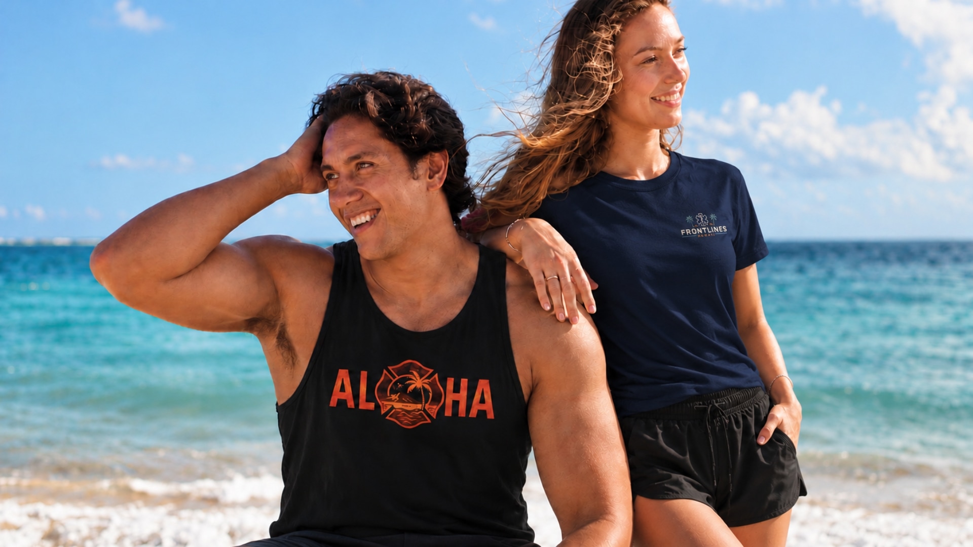 Two people wearing Frontlines apparel beside the ocean in Hawaiʻi