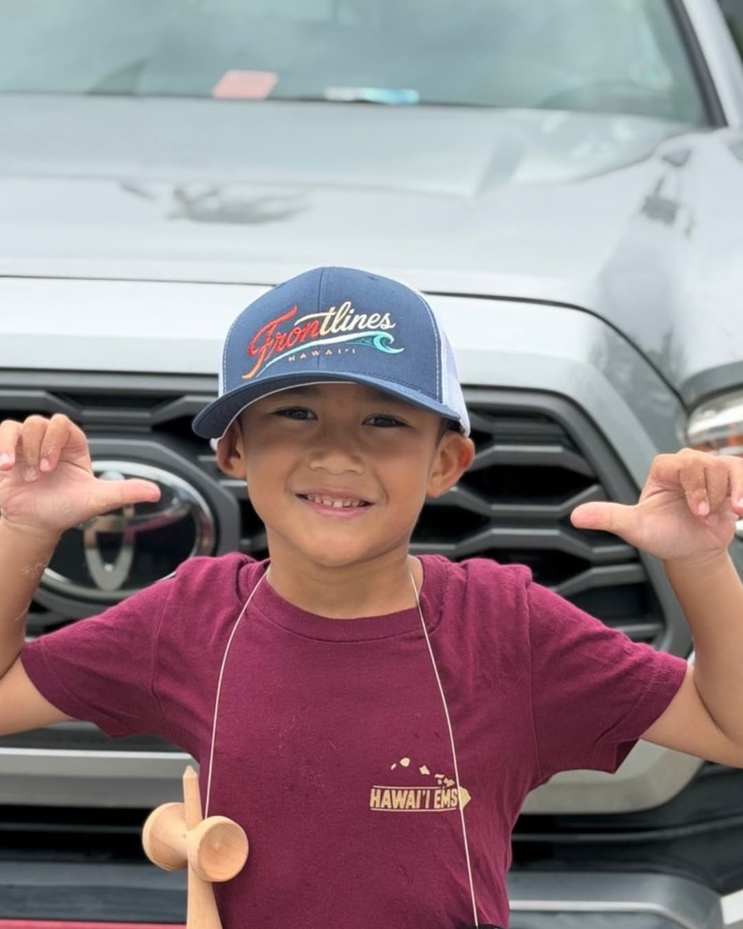 Child wearing a Frontlines cap