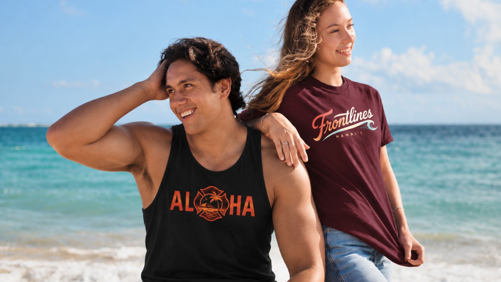 Two people wearing Frontlines apparel beside the ocean in Hawaiʻi